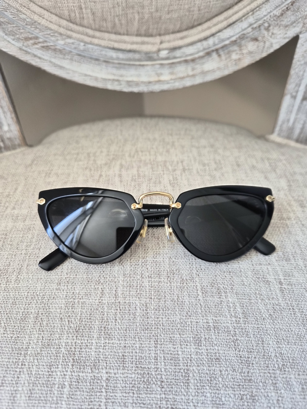 Miu Miu Black Cat-Eye Sunglasses with Gold Accents